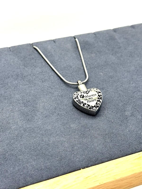 Silver "Always in my Heart" necklace with paw print.