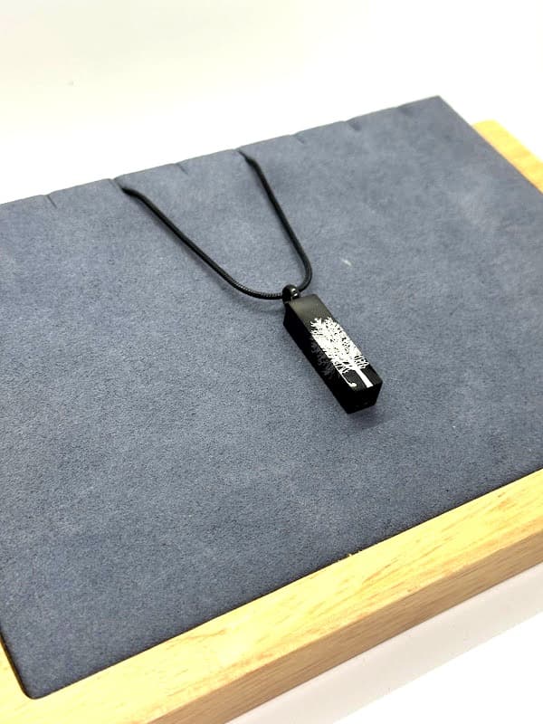 Black bar necklace with silver Tree of Life design.