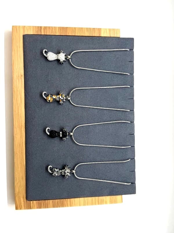 Crystal cat-shaped pendant. Available in clear/white, calico, black, and smokey.