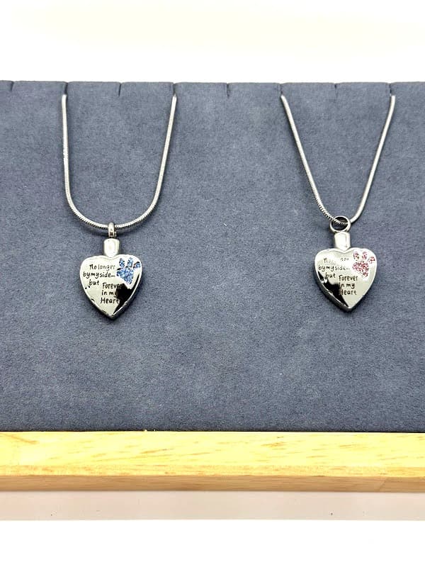 Silver "Forever in my Heart" necklace with crystal paw. Available with blue or pink crystals.