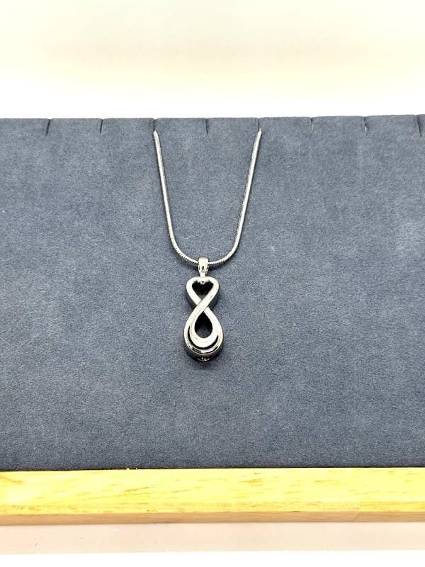Silver infinity heart necklace.