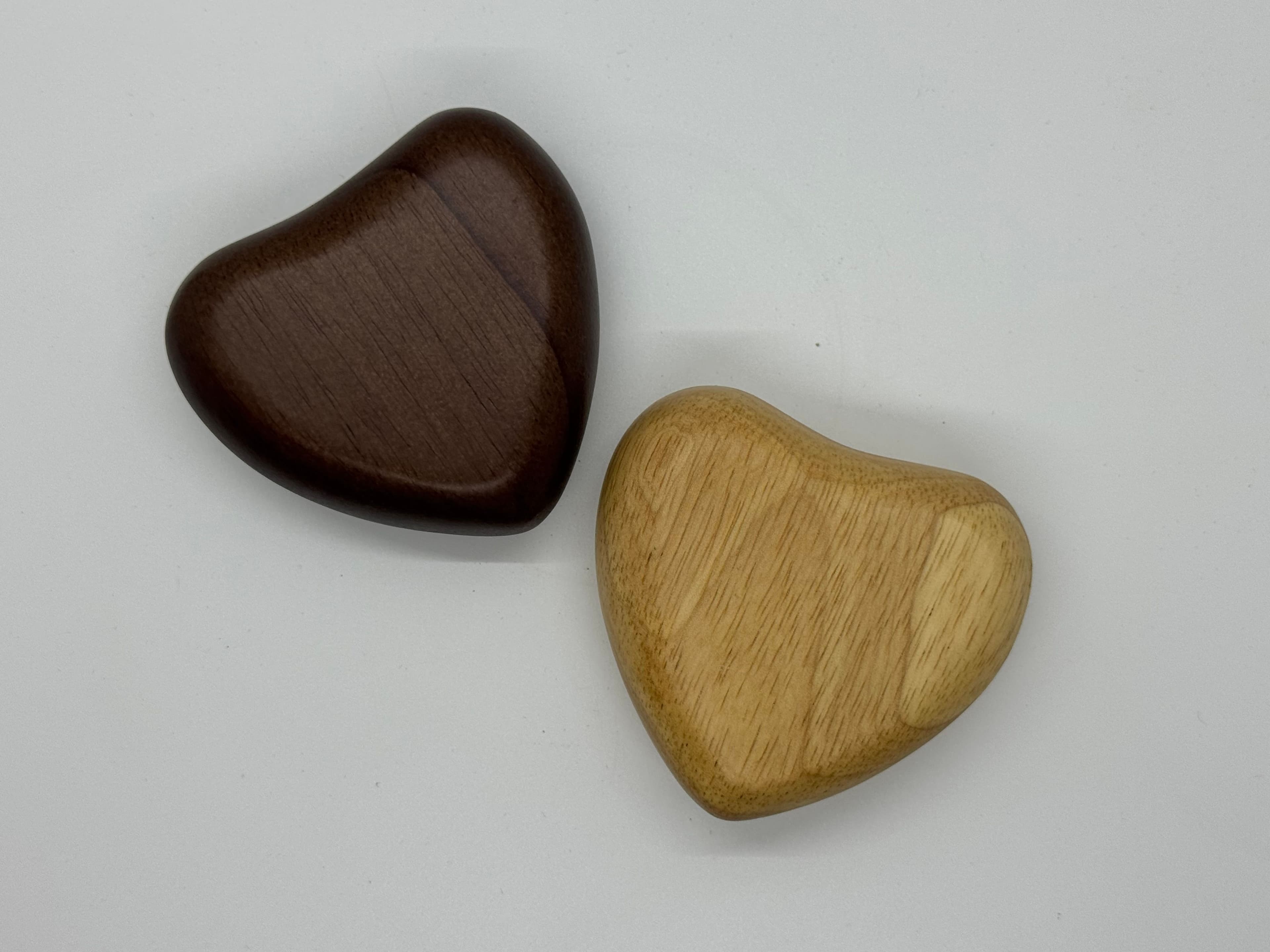 Wooden Heart Keepsake Urn, small enough to hold in the palm of your hand. Available in dark or light wood.