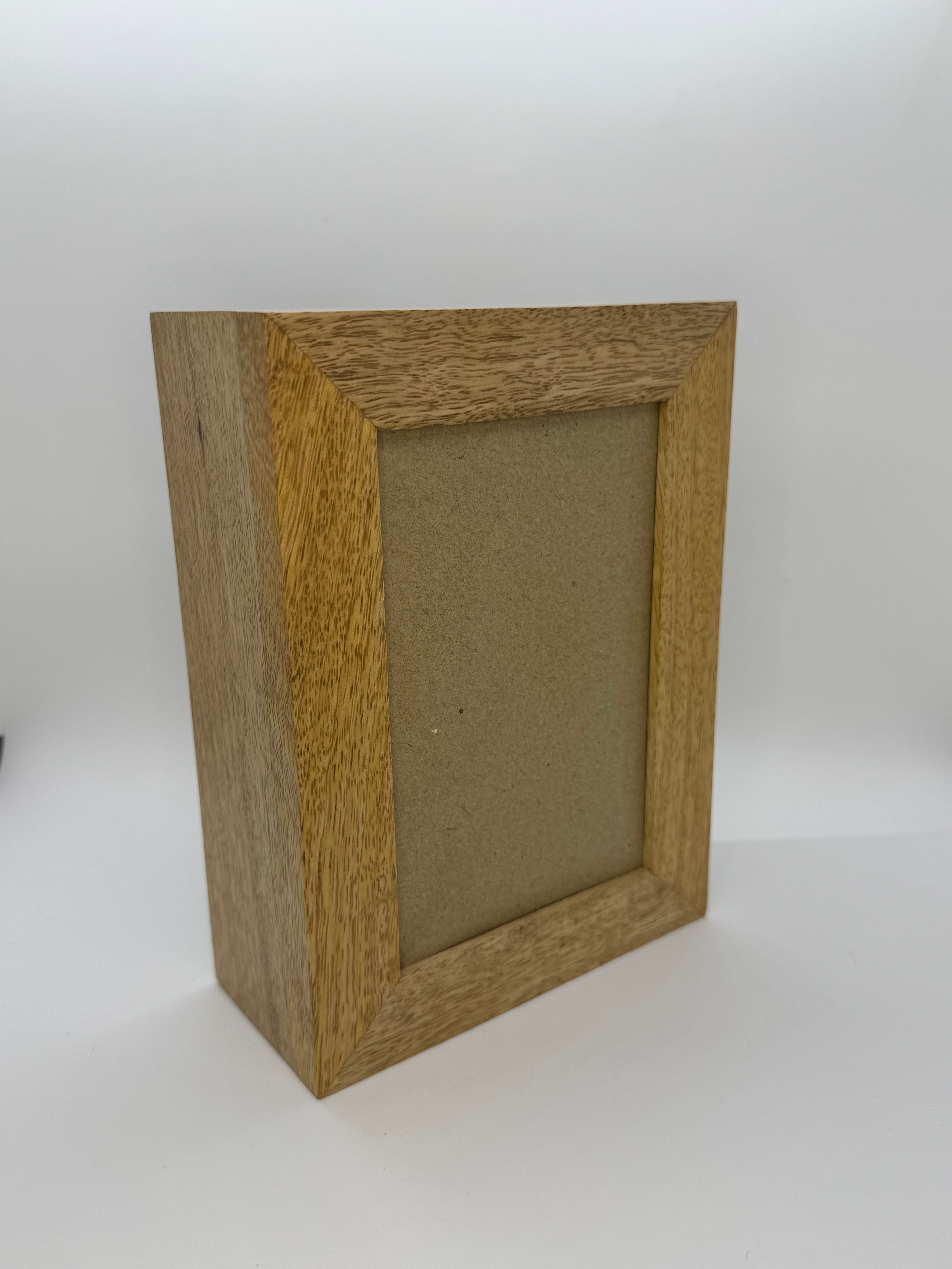 Wooden photo urn crafted from mango wood featuring a frame for your favorite photo.