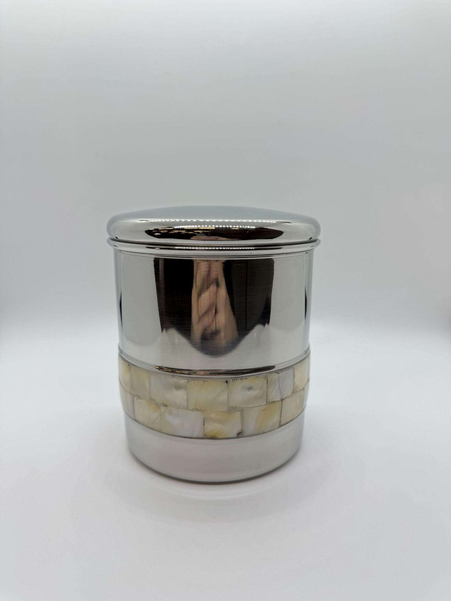Silver canister urn with mother of pearl decorative band.
