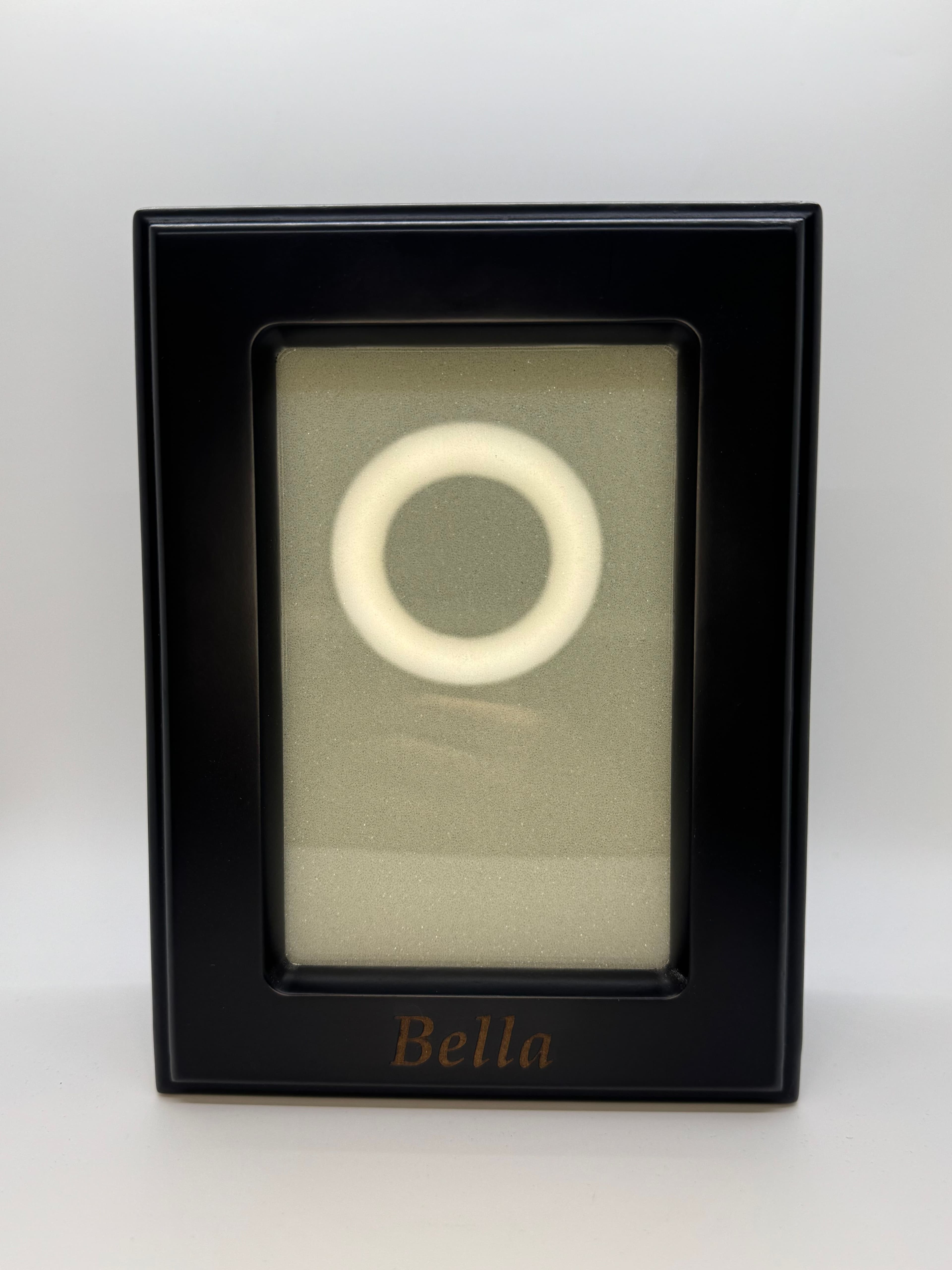 Black photo urn with frame window in portrait orientation.