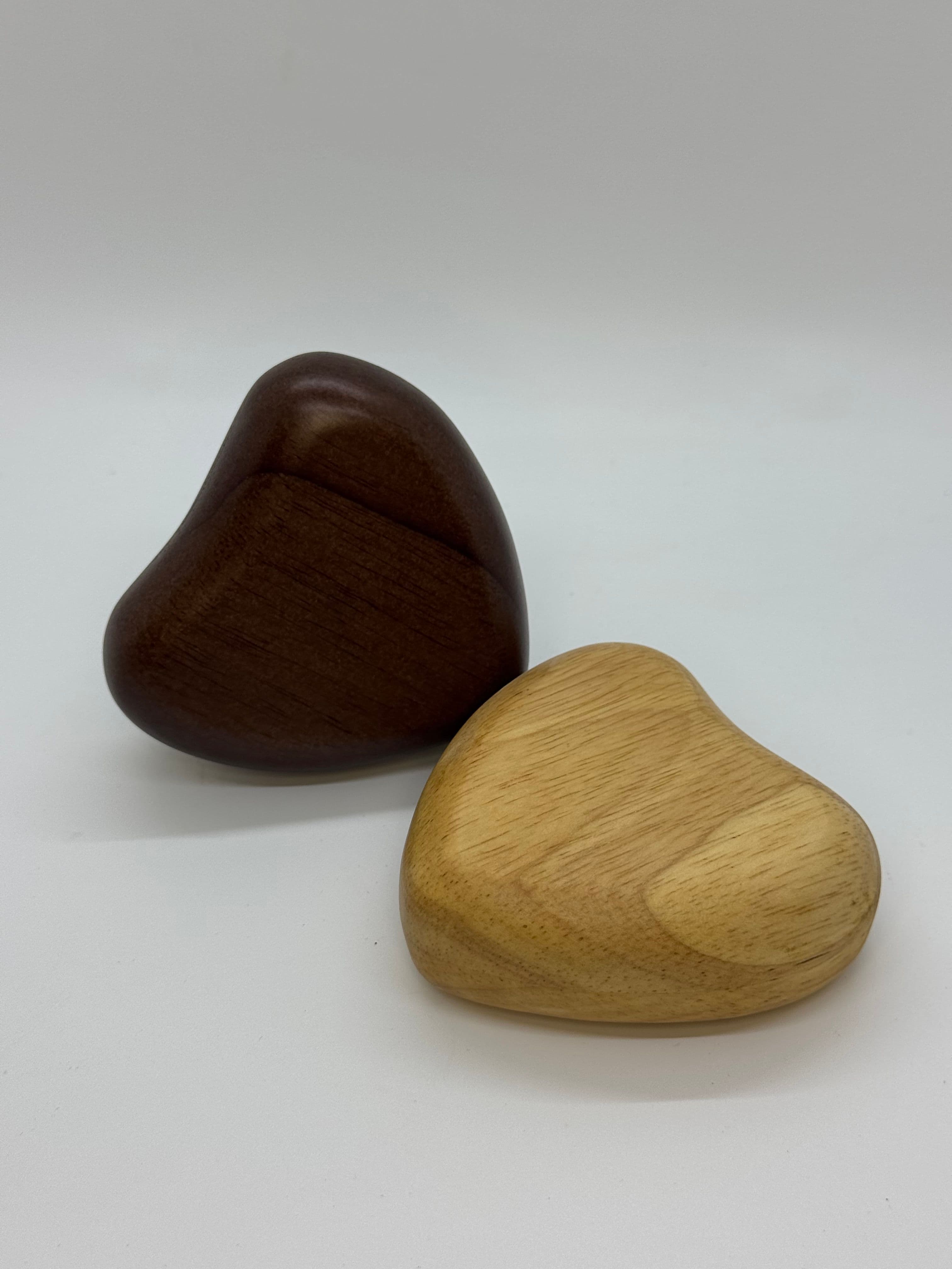 Wooden Heart Keepsake Urn, small enough to hold in the palm of your hand. Available in dark or light wood.