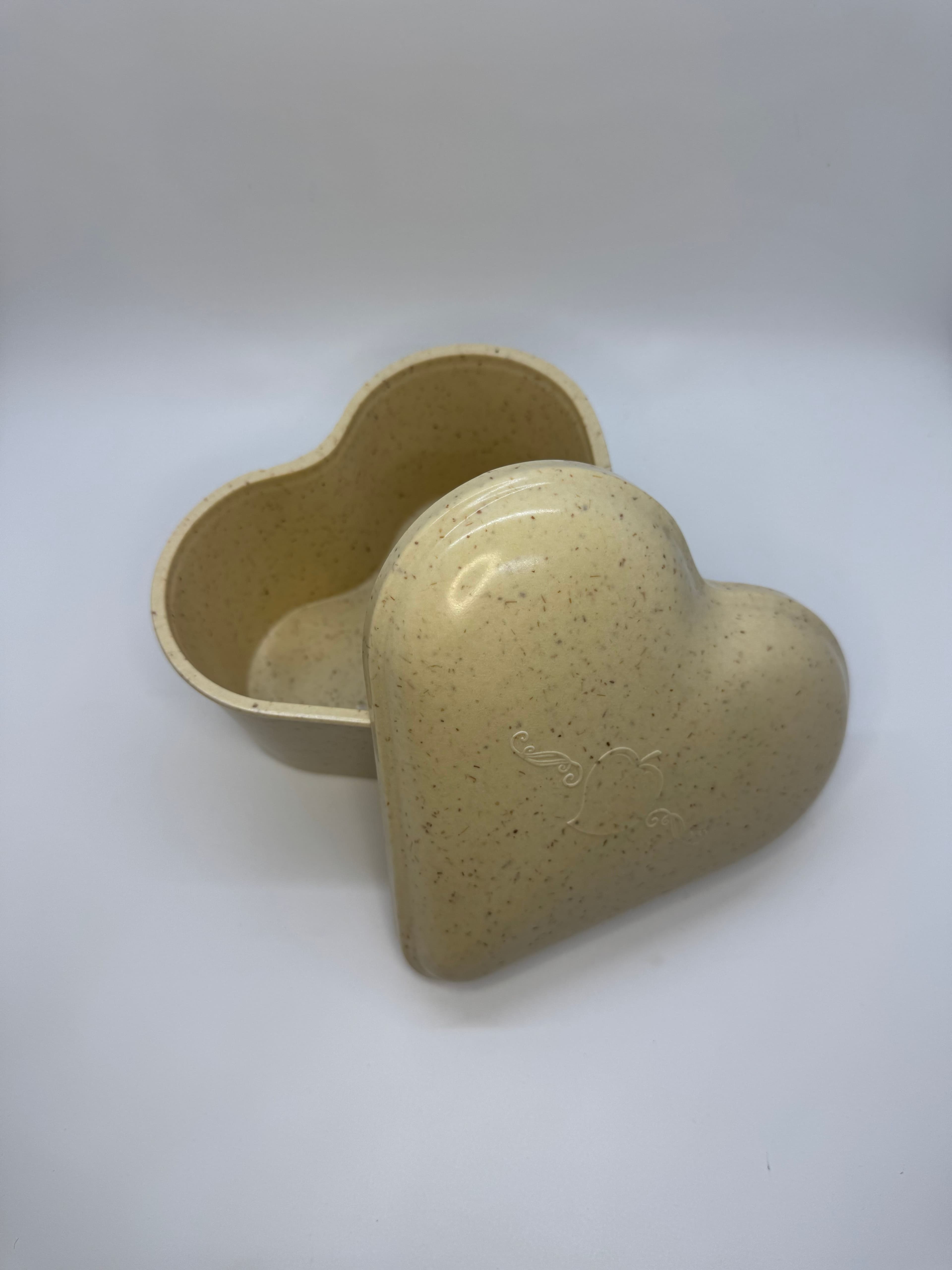 Small rosewood heart-shaped urn.