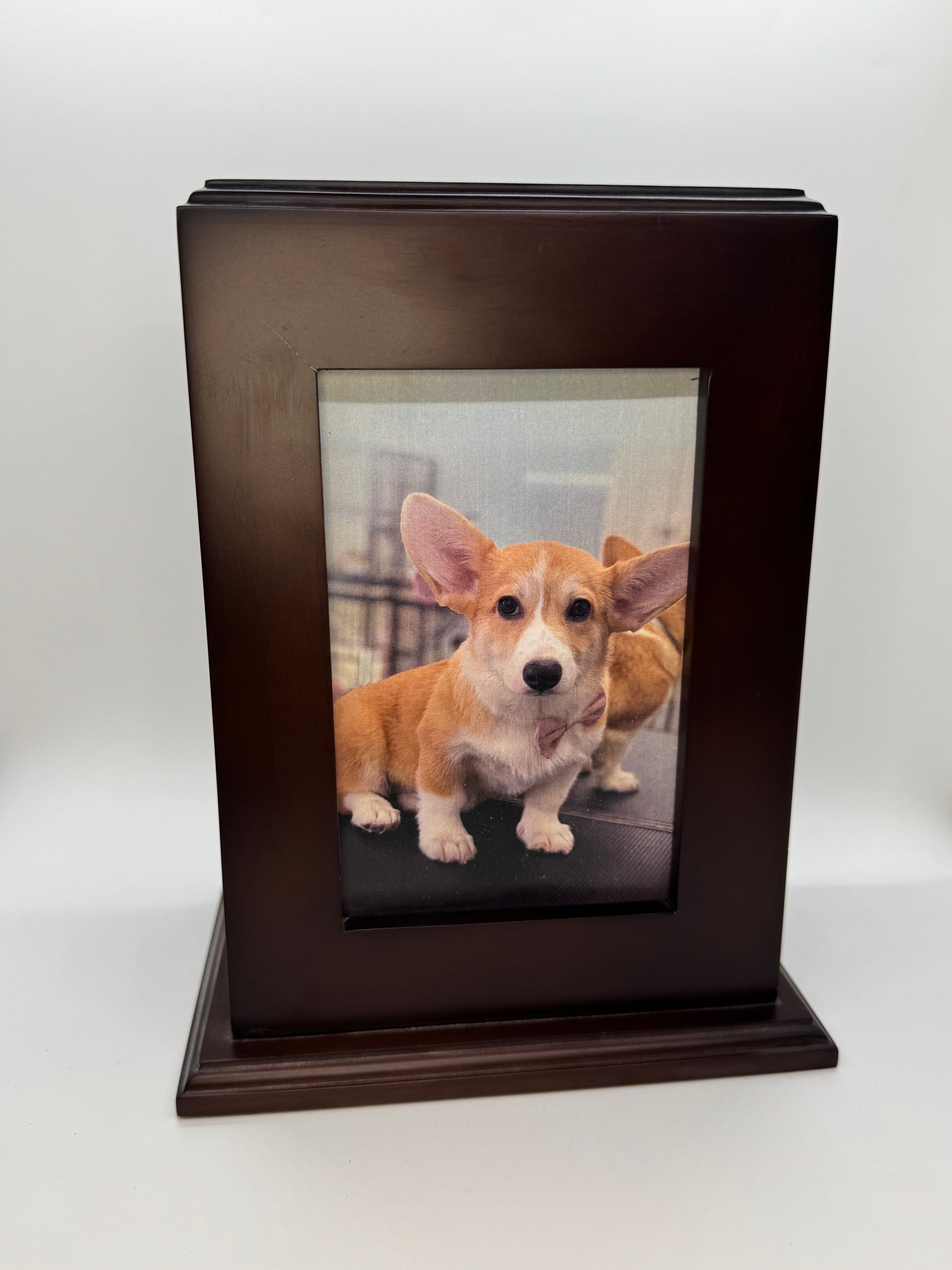 Walnut wood photo urn with frame window in portrait orientation.